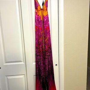 Flowy silk designer sun dress.  Fits beautifully.  Has crystal and rope accents